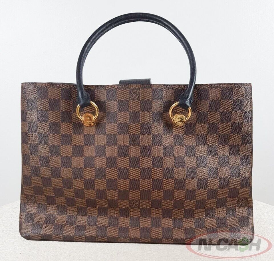 Louis Vuitton Black Riverside Damier Ebene Canvas Bag (Category: Luxury Bags & Wallets) located in Quezon City. Submitted by luxury_by_n-cash (Listing ID 1354061607, Image 2). Description: N-Cash Pawnshop "Instant Cash for Bags, Watches, Cars, and Electronics" https://www.ncash-pawnshop-philippines.com/ Louis Vuitton Black Riverside Damier Ebene Canvas Bag PRE-OWNED Brand: LOUIS VUITTON Measures: 14″ L x 9.5″ H x 4.5″ D (approx) 7″ Double Handle 
