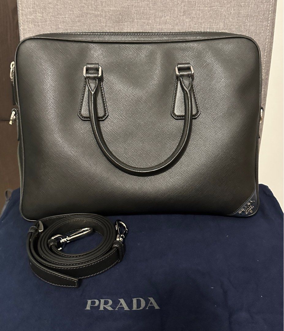 Prada Saffiano Leather briefcase (Category: Bags & Wallets) located in Singapore. Submitted by sy_sy (Listing ID 1354136288, Image 1). Description: Selling Cheap Prada Saffiano Leather Used few times only Very good condition Come with dust bag and unused strap 100% authentic .