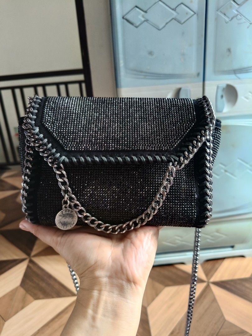 Stella McCartney Small Falabella Sling Bag (Category: Luxury Bags & Wallets) located in Batangas. Submitted by lynmejlight (Listing ID 1354018135, Image 1). Description: Stella McCartney Small Size Sling/Crossbody Bag. With normal sign of used sa minimal part ng chain sling sa ilalim at sa left side (not obvious) See last 2 photos. Very nice ng pgkacolor nya at kintab. Kasya cp at ang ganda/sosyal nya pagsuot😍.