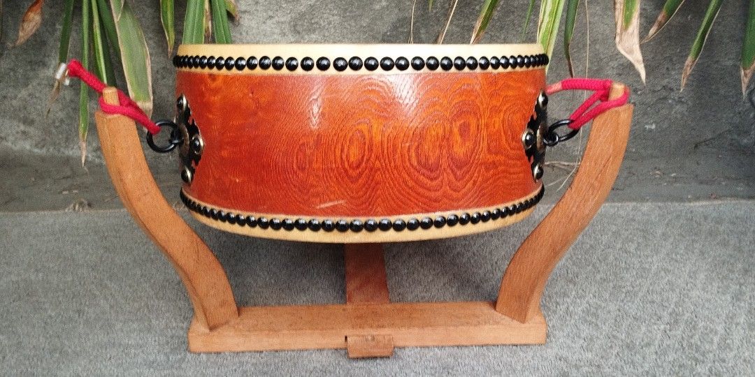 Taiko Flat drum japan musical instruments collection Display (Category: Musical Instruments) located in Malabon City. Submitted by immortalpicker (Listing ID 1354137308, Image 3). Description: Taiko Flat drum japan musical instruments Estimate size H= 6 1/2 inches Diameter = 14 1/2 Inches Material = wood - leather From Japan 2nd hand with scratch No warranty If there's Damage or Issues they can be seen in the last picture Price = 9,500 My locatio