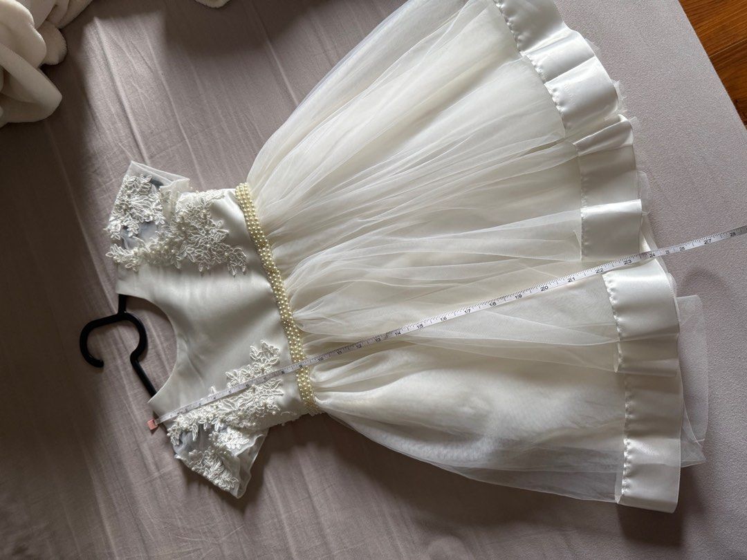 White Dress Girls (Category: Babies & Kids Fashion) located in Muntinlupa City. Submitted by eksamano (Listing ID 1353981597, Image 3). Description: Used once for 2 hrs for graduation. Bought for 2,800. Very good quality and soft fabric. Shoulder 10.5” Waist 23” Dress length 24”.
