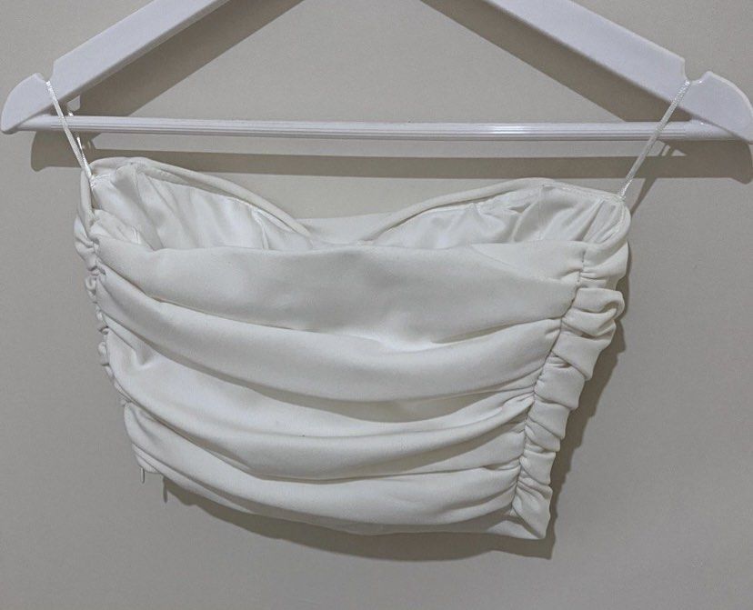 Zara White ruched draped corset top (Category: Sleeveless) located in Bacolod City. Submitted by dweeyaaaa (Listing ID 1354049651, Image 3). Description: a closet staple!! 🌟 -used once only!! -in perfect condition -small on tag but can fit semi medium frames also ✎ MOP: Maya ❀ Shipping from Bacolod (j&t or lbc) ᡣ𐭩 Negotiable! helping tags: stradivarious bershka h&m pull&bear mango shein zalora uniqlo terranova araw the line forever 21 zara love