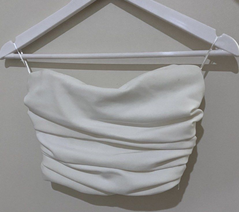 Zara White ruched draped corset top (Category: Sleeveless) located in Bacolod City. Submitted by dweeyaaaa (Listing ID 1354049651, Image 2). Description: a closet staple!! 🌟 -used once only!! -in perfect condition -small on tag but can fit semi medium frames also ✎ MOP: Maya ❀ Shipping from Bacolod (j&t or lbc) ᡣ𐭩 Negotiable! helping tags: stradivarious bershka h&m pull&bear mango shein zalora uniqlo terranova araw the line forever 21 zara love