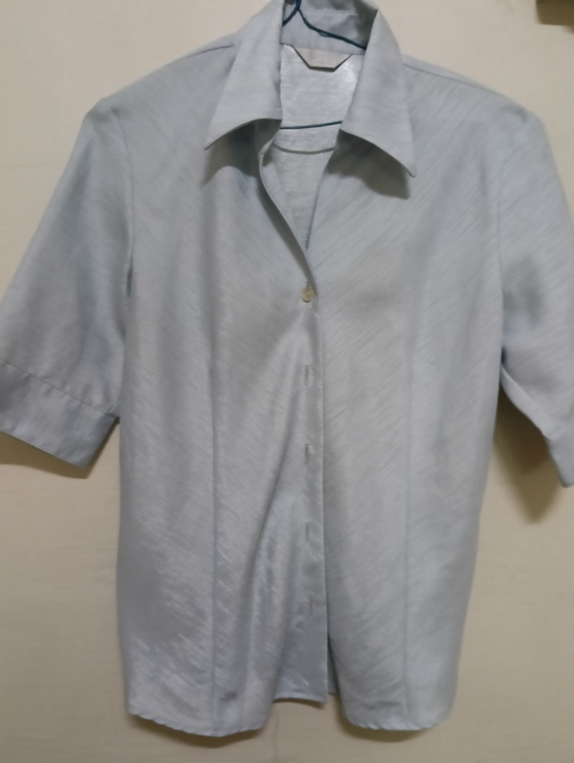 Light blue and multi-color women’s classic collar top.