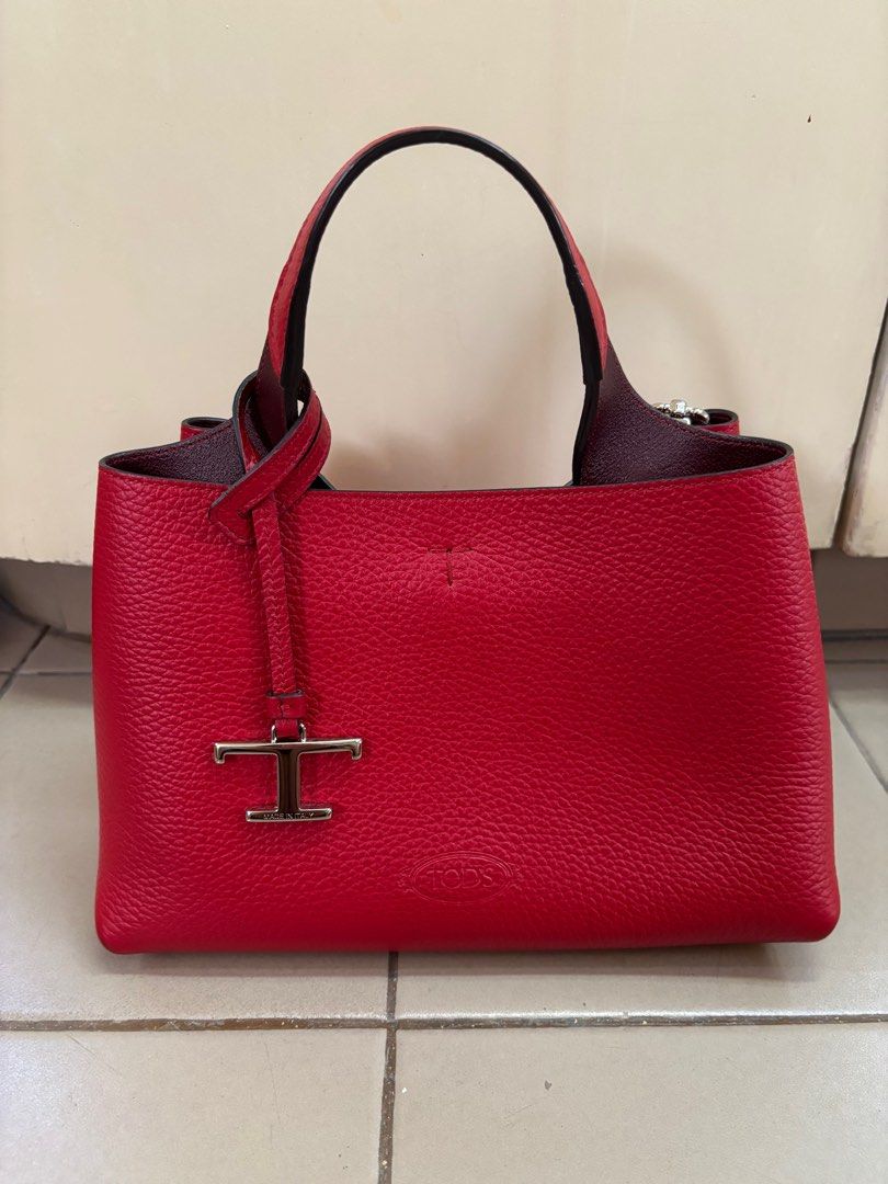 TODS Red Leather Handbag. Comes with shoulder strap (Category: Luxury Bags & Wallets) located in Makati City. Submitted by scarwee (Listing ID 1354165273, Image 1). Description: Used a few times. No flaws.