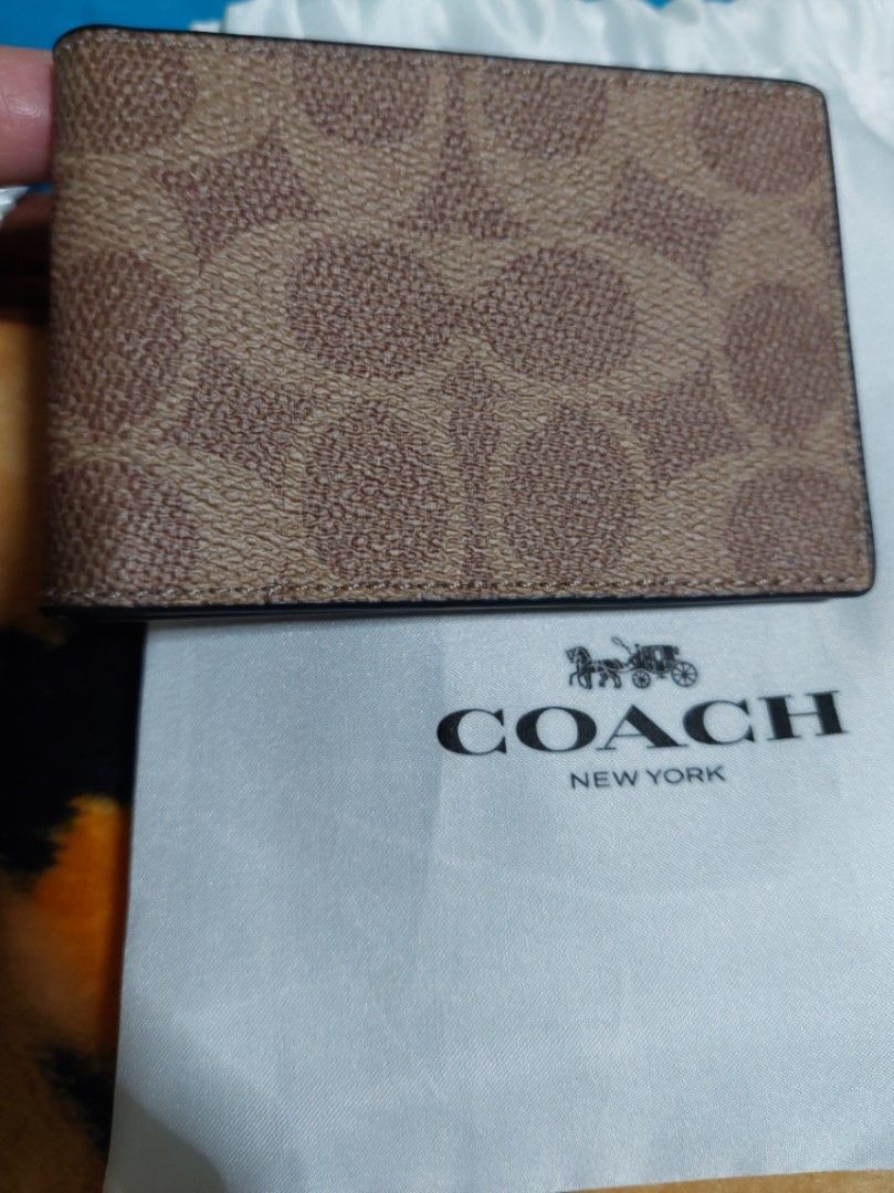 Authentic Coach Card Holder (Category: Luxury Bags & Wallets) located in Paranaque City. Submitted by erick_e (Listing ID 1354352344, Image 1). Description: 1pc Authentic Coach Brown Card Holder Bought from Rockwell Coach Store Brand New Rfs owner only uses Wallet Whole price 17,900 kindly chat or sms 0915 727 06 33 Meet up at Sm Bicutan or Marcelo Green Village Paranaque West service road..