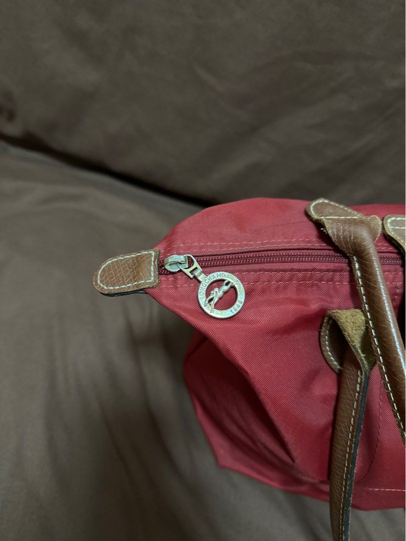 Authentic LONGCHAMP 💯 (Category: Luxury Bags & Wallets) located in Cavite. Submitted by trendydotnet (Listing ID 1288389254, Image 2). Description: READ BELOW! SWIPE➡️ PHOTO DETAILS 🔍ITEM GUARANTEDD 💯% AUTHENTIC Authentic LONGCHAMP - with Paper bag and Authenticity card - Faded parts in Gold hardware - Scuffing at the corners - There is a tear inside the bag. - Stain outside (See Photo) Im not sure if matatanggal pa if punasan or brush. Haven’