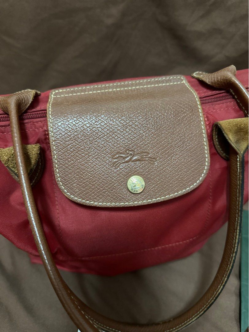 Authentic LONGCHAMP 💯 (Category: Luxury Bags & Wallets) located in Cavite. Submitted by trendydotnet (Listing ID 1288389254, Image 3). Description: READ BELOW! SWIPE➡️ PHOTO DETAILS 🔍ITEM GUARANTEDD 💯% AUTHENTIC Authentic LONGCHAMP - with Paper bag and Authenticity card - Faded parts in Gold hardware - Scuffing at the corners - There is a tear inside the bag. - Stain outside (See Photo) Im not sure if matatanggal pa if punasan or brush. Haven’