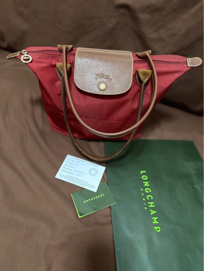 Authentic LONGCHAMP 💯 (Category: Luxury Bags & Wallets) located in Cavite. Submitted by trendydotnet (Listing ID 1288389254, Image 1). Description: READ BELOW! SWIPE➡️ PHOTO DETAILS 🔍ITEM GUARANTEDD 💯% AUTHENTIC Authentic LONGCHAMP - with Paper bag and Authenticity card - Faded parts in Gold hardware - Scuffing at the corners - There is a tear inside the bag. - Stain outside (See Photo) Im not sure if matatanggal pa if punasan or brush. Haven’