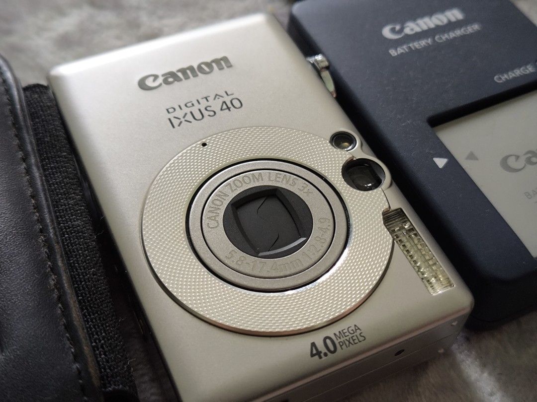 Canon Ixus 40 + battery + charger, Photography, Cameras on Carousell