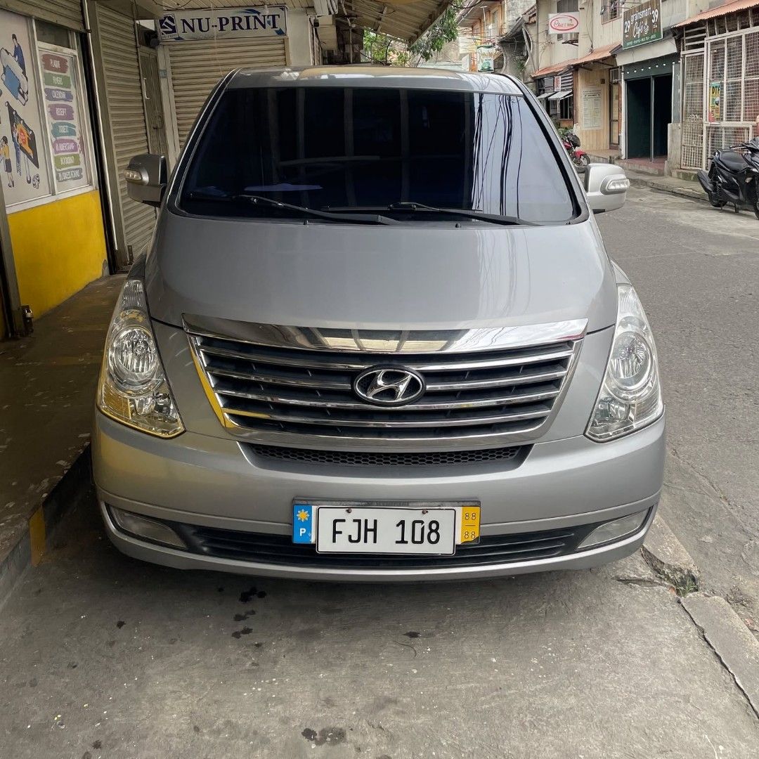 Hyundai Starex (Category: Used Cars) located in Mandaluyong City. Submitted by waffleivy (Listing ID 1354461029, Image 2). Description: * from Korea Personal Family Car Mileage 81,089km Automatic Transmission 11 seater (4 rows) Swivel Seats Gray Leather Seats (Better than local) Diesel (From Petron or Shell only) Cold AC (Best for Ph weather) Thick New Tires With Backup Camera With Backup Sensors Shaded Parking Heavy PMS last January 2025 Under m