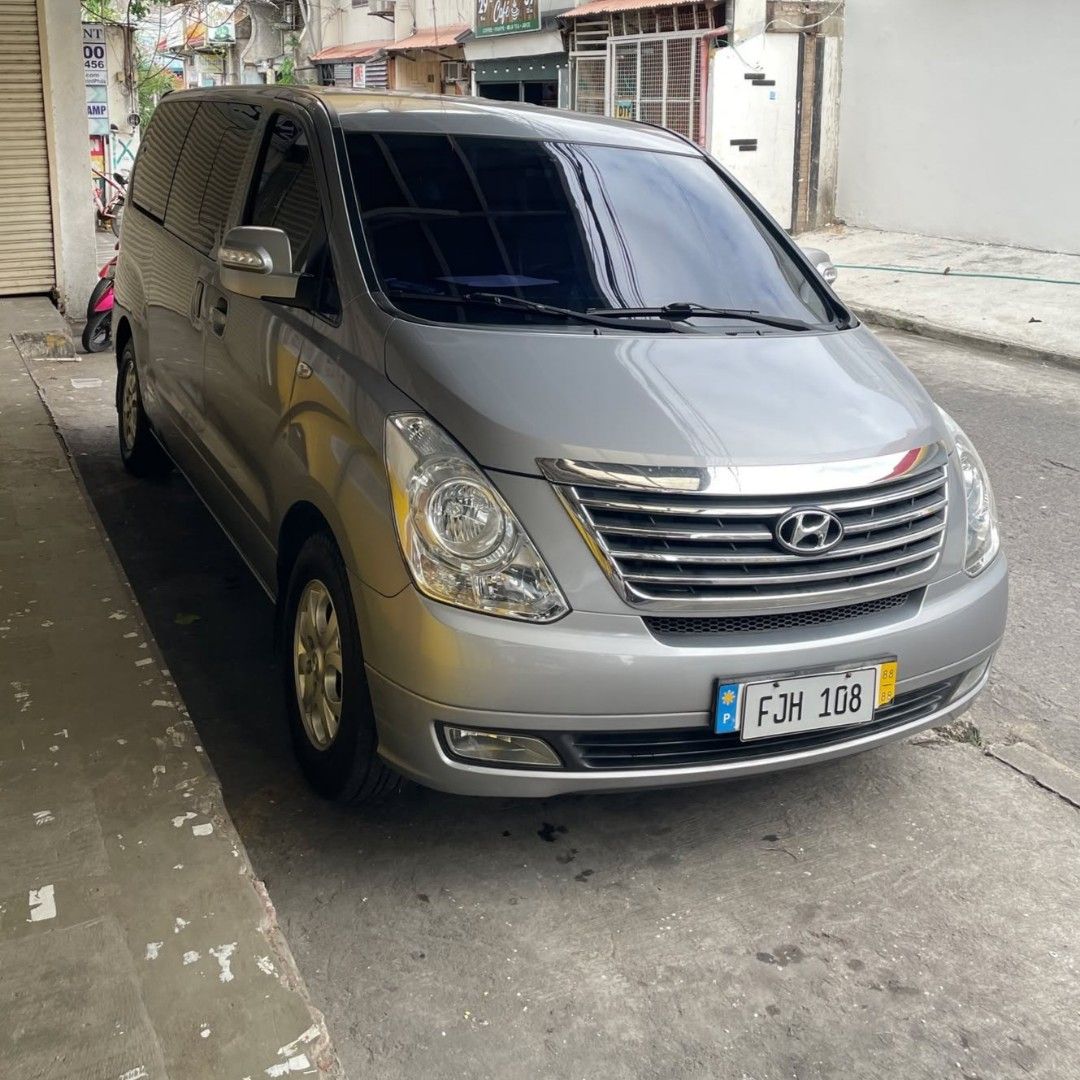 Hyundai Starex (Category: Used Cars) located in Mandaluyong City. Submitted by waffleivy (Listing ID 1354461029, Image 1). Description: * from Korea Personal Family Car Mileage 81,089km Automatic Transmission 11 seater (4 rows) Swivel Seats Gray Leather Seats (Better than local) Diesel (From Petron or Shell only) Cold AC (Best for Ph weather) Thick New Tires With Backup Camera With Backup Sensors Shaded Parking Heavy PMS last January 2025 Under m
