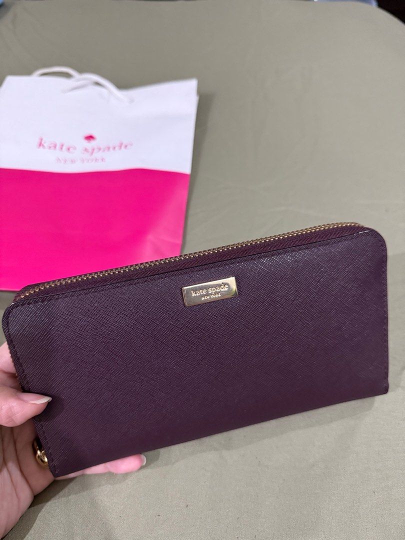 Kate Spade saffiano wallet (Category: Wallets & Card holders) located in Quezon City. Submitted by millennialdeclutterer (Listing ID 1354479578, Image 2). Description: Authentic Kate Spade long wallet in saffiano leather. Inclusions: paper bag & care card. Condition 9/10 almost brand new😊.
