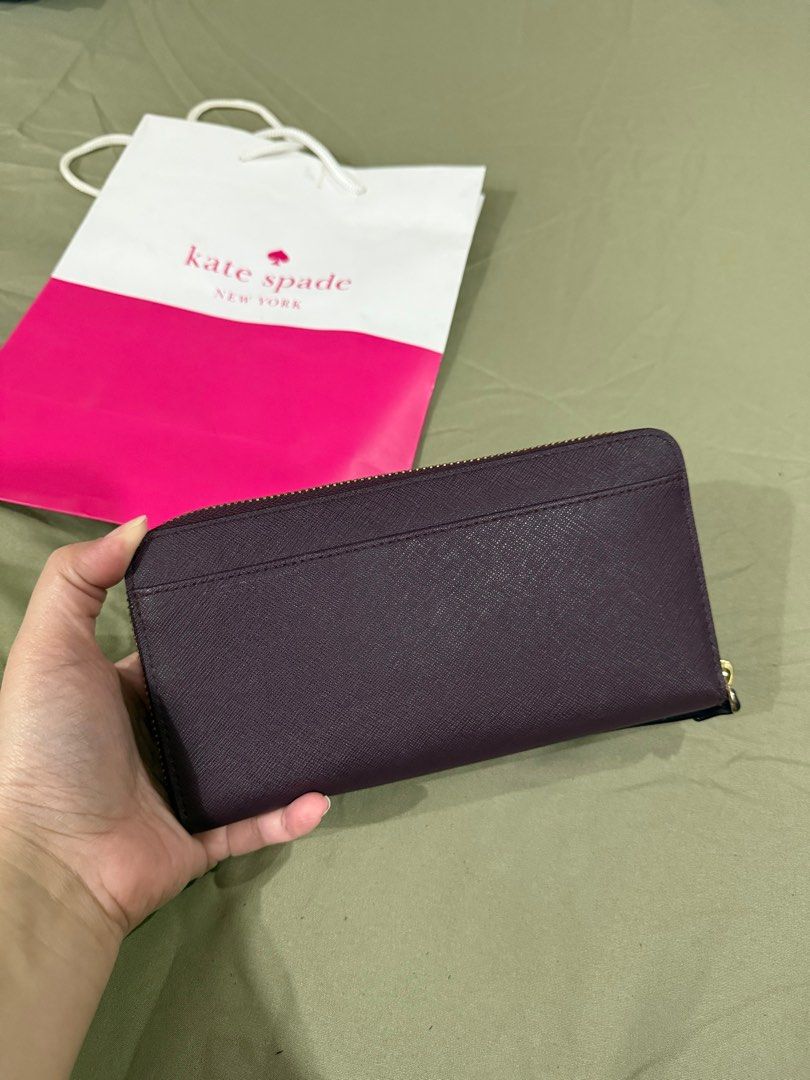 Kate Spade saffiano wallet (Category: Wallets & Card holders) located in Quezon City. Submitted by millennialdeclutterer (Listing ID 1354479578, Image 3). Description: Authentic Kate Spade long wallet in saffiano leather. Inclusions: paper bag & care card. Condition 9/10 almost brand new😊.