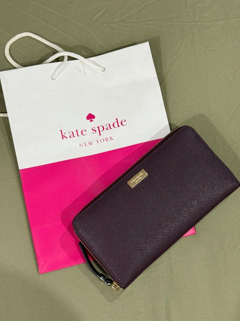 Kate Spade saffiano wallet (Category: Wallets & Card holders) located in Quezon City. Submitted by millennialdeclutterer (Listing ID 1354479578, Image 1). Description: Authentic Kate Spade long wallet in saffiano leather. Inclusions: paper bag & care card. Condition 9/10 almost brand new😊.