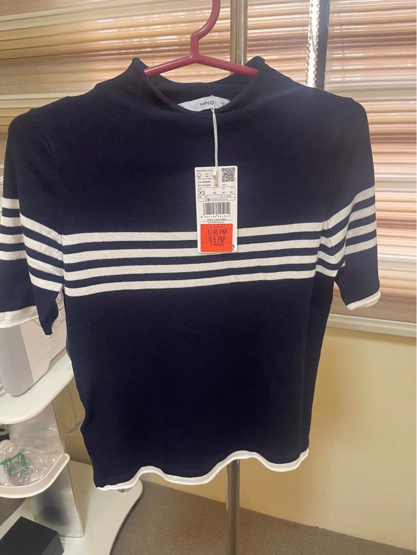 Mango Blue T-shirt, White Stripe, Navy Blue (Category: Shirts) located in Malabon City. Submitted by roch1212 (Listing ID 1352328008, Image 1). Description: ### Navy Blue T-Shirt from Mango for Sale - Condition: Used only once, like new - Original Price: ₱1,695 - Purchased Price: ₱995 - Selling Price: ₱500 (great bargain!) - Size: XS - Color: Blue - Reason for Selling: Too small for me - Brand: Mango *Grab this stylish Mango t-shirt at an amazing