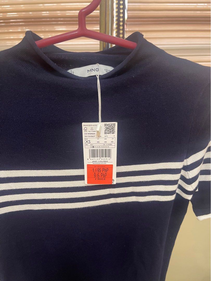 Mango Blue T-shirt, White Stripe, Navy Blue (Category: Shirts) located in Malabon City. Submitted by roch1212 (Listing ID 1352328008, Image 2). Description: ### Navy Blue T-Shirt from Mango for Sale - Condition: Used only once, like new - Original Price: ₱1,695 - Purchased Price: ₱995 - Selling Price: ₱500 (great bargain!) - Size: XS - Color: Blue - Reason for Selling: Too small for me - Brand: Mango *Grab this stylish Mango t-shirt at an amazing