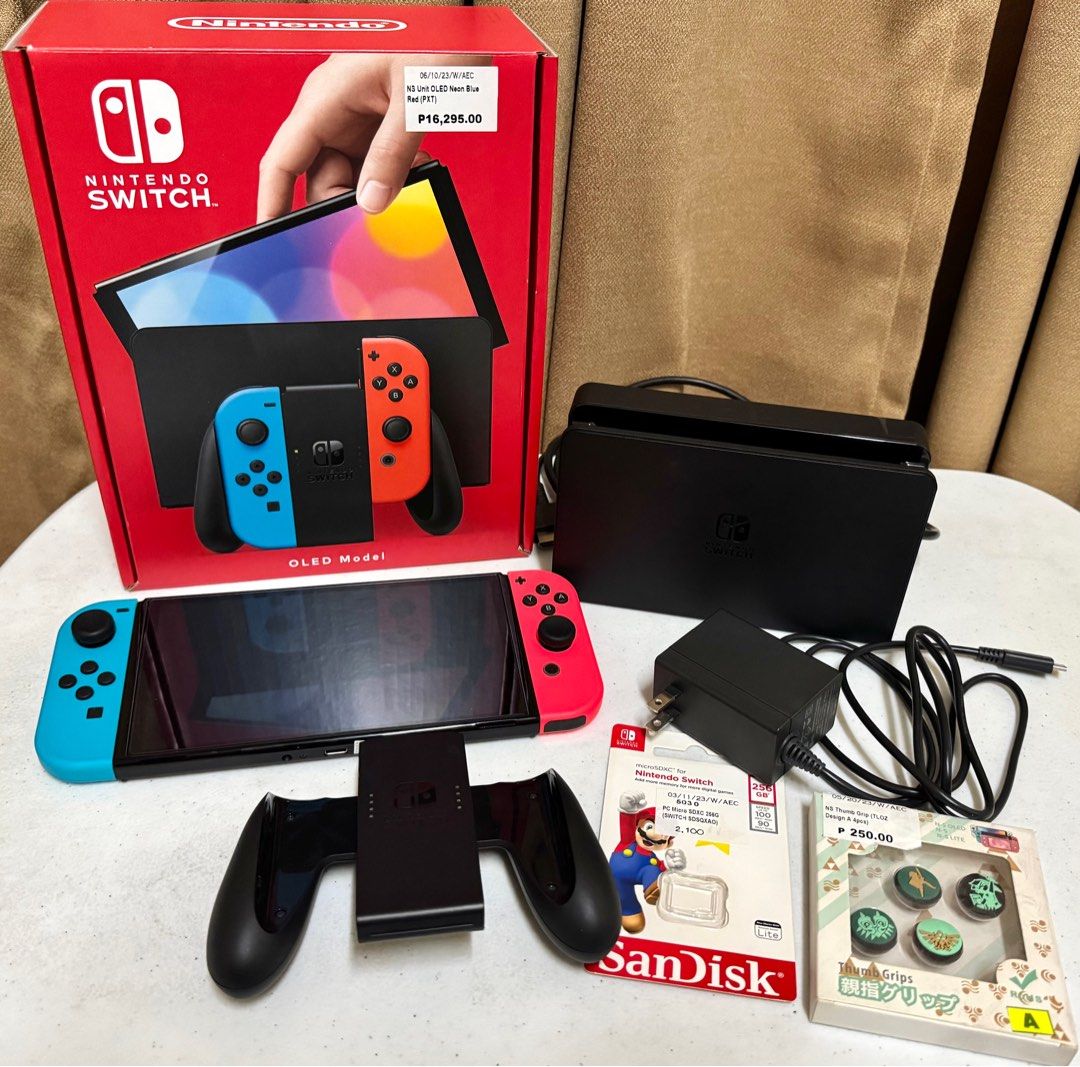 Nintendo Switch OLED Bundle with Games and Starter Kit (Category: Nintendo) located in Manila. Submitted by simplyjane01 (Listing ID 1354383558, Image 2). Description: Nintendo Switch OLED Bundle with Games and Starter Kit (ALL-IN) ✅ Inclusions: 🔸Nintendo Switch OLED 🔸SanDisk SD Card 256GB 🔸9 in 1 Starter Kit for Switch (Protective film already installed) 🔸4 Nintendo Switch Games - Super Smash Bros. Ultimate, Mario Kart 8 Deluxe, Eiyuden Chro
