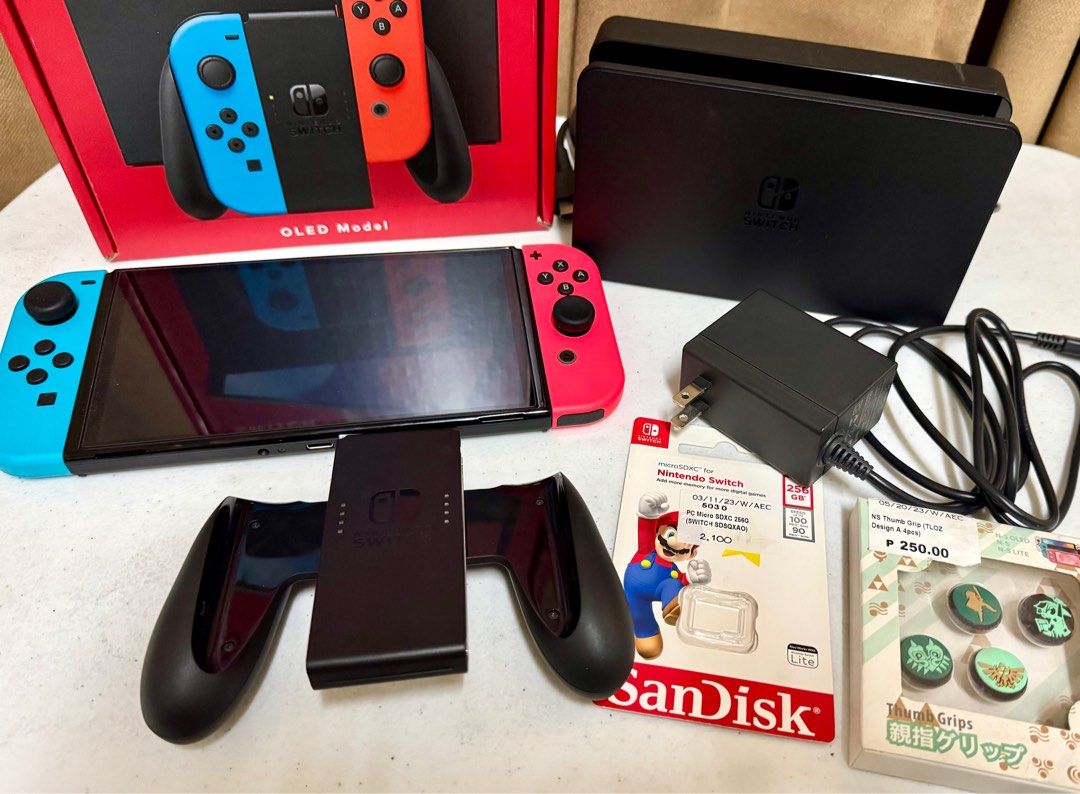 Nintendo Switch OLED Bundle with Games and Starter Kit (Category: Nintendo) located in Manila. Submitted by simplyjane01 (Listing ID 1354383558, Image 1). Description: Nintendo Switch OLED Bundle with Games and Starter Kit (ALL-IN) ✅ Inclusions: 🔸Nintendo Switch OLED 🔸SanDisk SD Card 256GB 🔸9 in 1 Starter Kit for Switch (Protective film already installed) 🔸4 Nintendo Switch Games - Super Smash Bros. Ultimate, Mario Kart 8 Deluxe, Eiyuden Chro