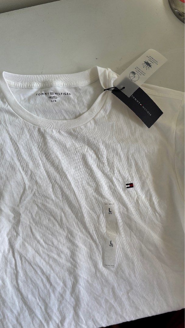 Tommy Hilfiger White Shirt (Category: Tshirts & Polo Shirts ) located in Makati City. Submitted by foojustin (Listing ID 1354403430, Image 2). Description: Brand new with tags. Issue: needs ironing. Stocked. .