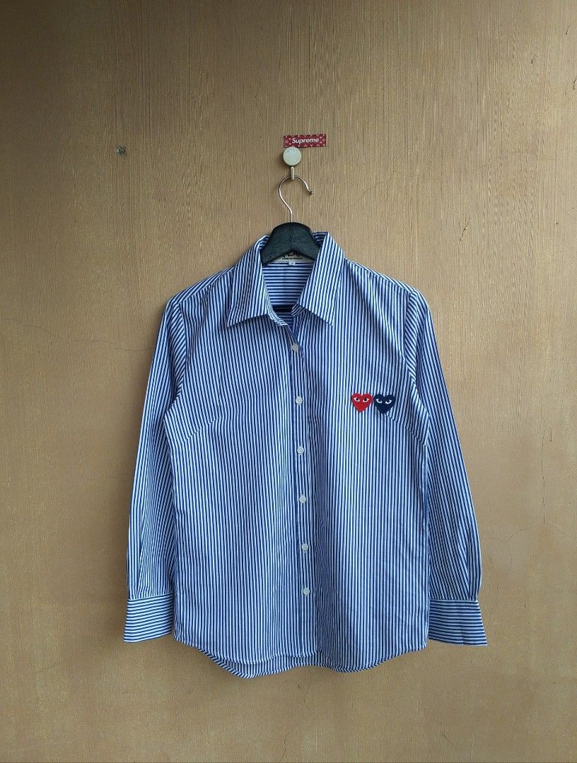 CDG play striped double heart button down polo long sleeve (Category: Luxury Apparel) located in Lipa City. Submitted by MEECHYTWO2TWO (Listing ID 1354616949, Image 3). Description: CDG play striped double heart button down polo long sleeve Medium frame width: 19 / front length: 27 / back length: 28 issue: 1 missing button need replacement button Sobrang ganda pa sa personal Excellent condition color rate: 10/10 additional sf +75 mop: GCASH/NO CO