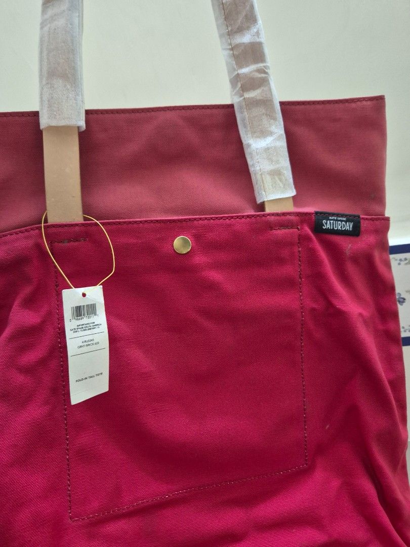 Kate Spade (Saturday) canvas tote (Category: Shoulder Bags) located in Pasig City. Submitted by 53888 (Listing ID 1354686258, Image 3). Description: brand new Kate Spade tote (unisex) thick canvas with leather strap color: Red.