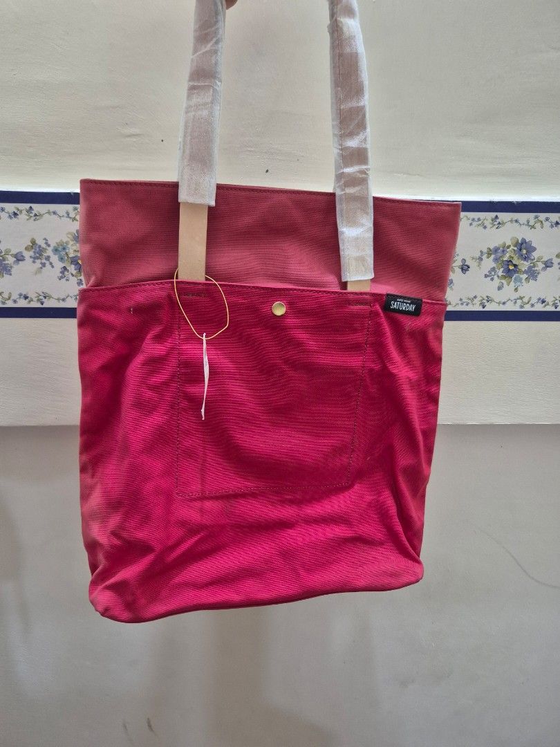 Kate Spade (Saturday) canvas tote (Category: Shoulder Bags) located in Pasig City. Submitted by 53888 (Listing ID 1354686258, Image 1). Description: brand new Kate Spade tote (unisex) thick canvas with leather strap color: Red.