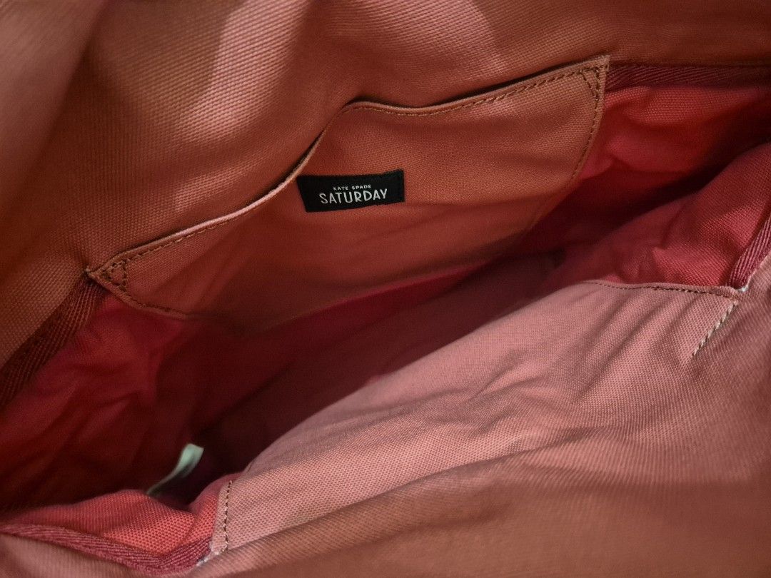 Kate Spade (Saturday) canvas tote (Category: Shoulder Bags) located in Pasig City. Submitted by 53888 (Listing ID 1354686258, Image 2). Description: brand new Kate Spade tote (unisex) thick canvas with leather strap color: Red.