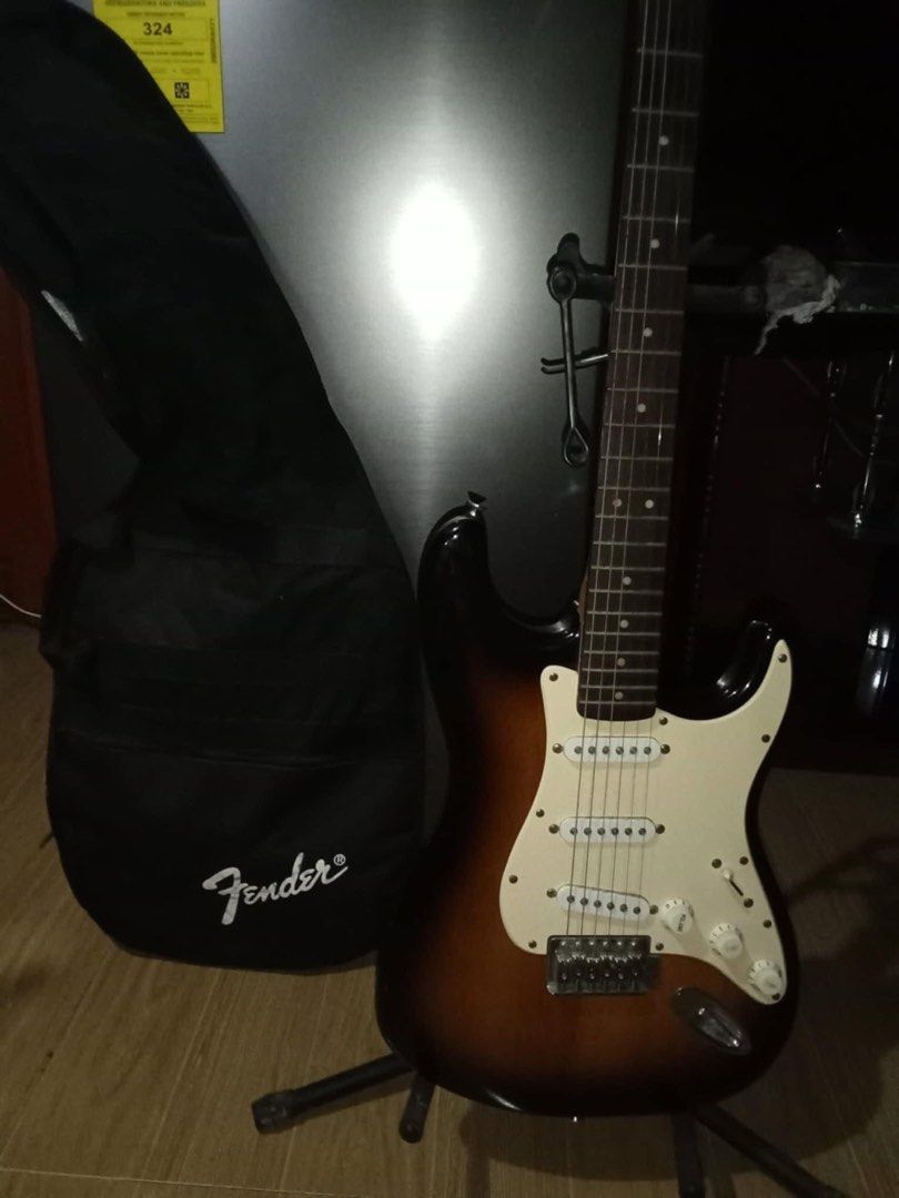SQUIER STRATOCASTER ELECTRIC GUITAR (Category: Musical Instruments) located in Manila. Submitted by 2db7wtymmn29490 (Listing ID 1354530560, Image 2). Description: NO ISSUE RFS: NEED CASH ASAP INCLUSIONS: SQUIER STRATOCASTER BY FENDER (10k) FENDER FRONTMAN 20G GUITAR BAG STRAP Set for: 12k (negotiable) Bought everything for: 23k DOP: Feb 3, 2025 .