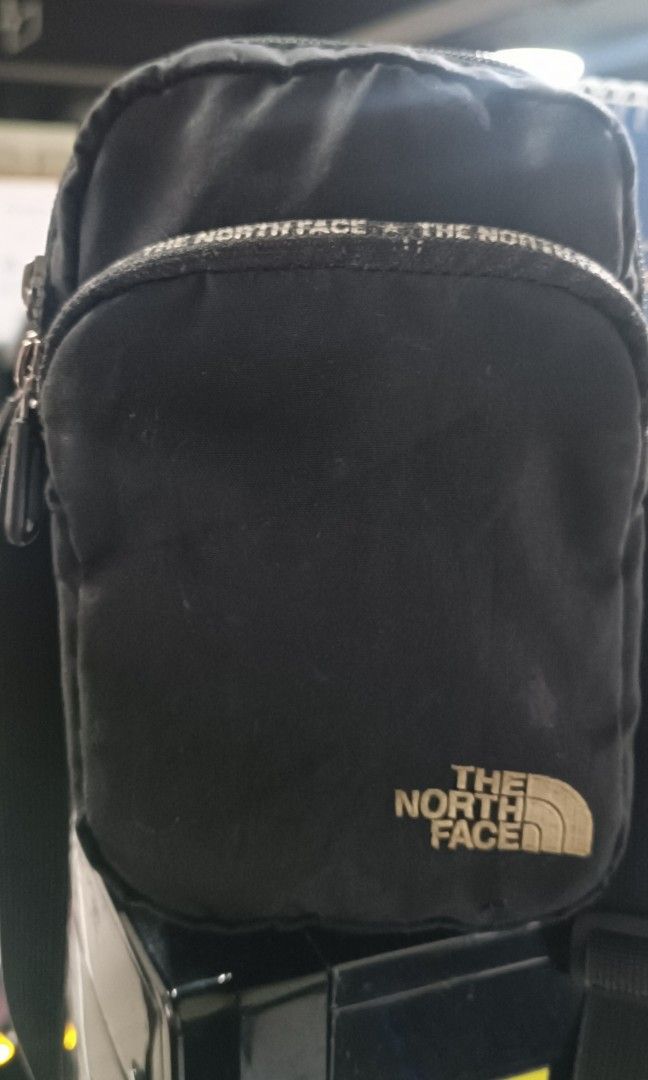 The North Face (Category: Sling Bags) located in San Juan City. Submitted by ag0807 (Listing ID 1354660234, Image 1). Description: The North Face sling bag black minor issue pointed hole slight negotiable.