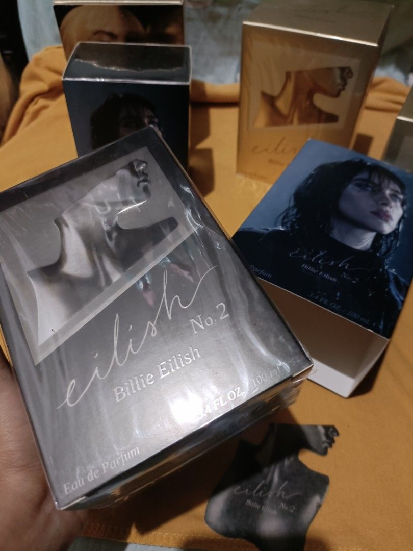 ORIGINAL Eilish No. 2 Eau de Parfum by Billie Eilish 100ml (BLACK) (Category: Fragrance & Deodorants) located in Pasay City. Submitted by declutterwifmeee (Listing ID 1354804110, Image 1). Description: Eilish No. 2 is an alluring Woody Floral fragrance featuring notes of apple blossom, wild wet poppy flowers, and palo santo. Top Notes Italian Bergamot, Apple Blossom, Incense Middle Notes Papyrus, Black Pepper, Wild Poppy Flower Base Notes Palo Sa