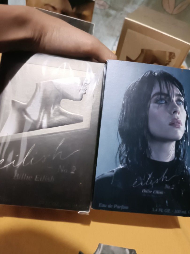 ORIGINAL Eilish No. 2 Eau de Parfum by Billie Eilish 100ml (BLACK) (Category: Fragrance & Deodorants) located in Pasay City. Submitted by declutterwifmeee (Listing ID 1354804110, Image 3). Description: Eilish No. 2 is an alluring Woody Floral fragrance featuring notes of apple blossom, wild wet poppy flowers, and palo santo. Top Notes Italian Bergamot, Apple Blossom, Incense Middle Notes Papyrus, Black Pepper, Wild Poppy Flower Base Notes Palo Sa