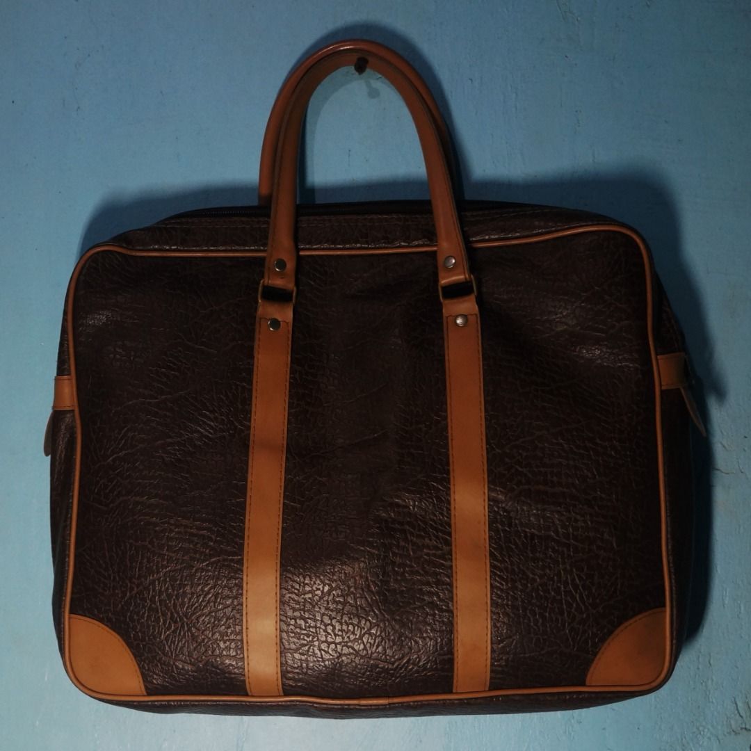 Brown Laptop Bag (Category: Laptop Bags & Sleeves) located in Taguig. Submitted by tcstuff (Listing ID 1354881456, Image 2). Description: Length: 14 in x 11 in x 2.3 in Material: PU Leather Lining: Vinyl Newly cleaned. Newly polished metal hardware. Payment Method: GCash or LBC Cash on Delivery /Cash on Pickup .