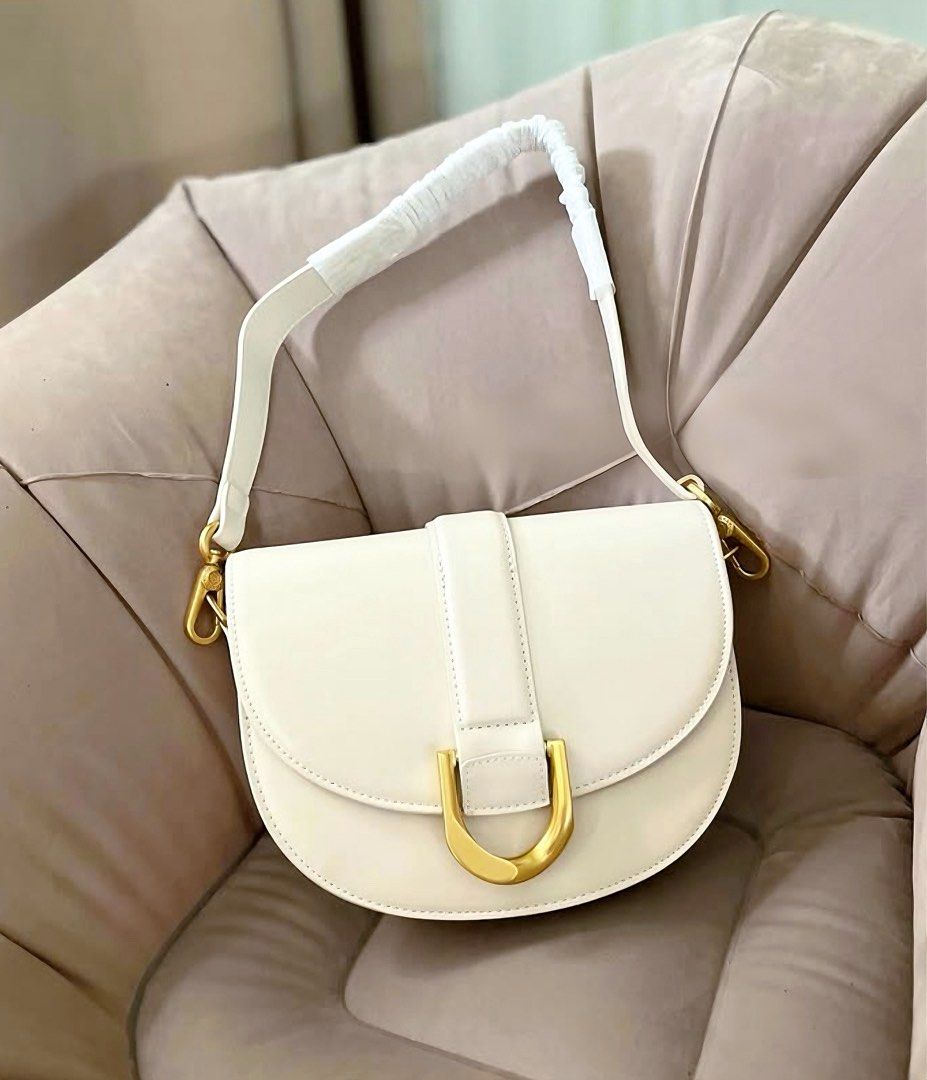 Charles & Keith Gabine Saddle Bag (Category: Shoulder Bags) located in Manila. Submitted by declutterwithmarga (Listing ID 1354837745, Image 1). Description: .