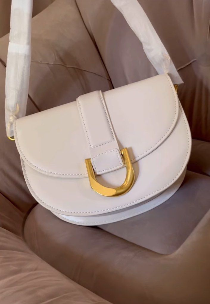 Charles & Keith Gabine Saddle Bag (Category: Shoulder Bags) located in Manila. Submitted by declutterwithmarga (Listing ID 1354837745, Image 3). Description: .