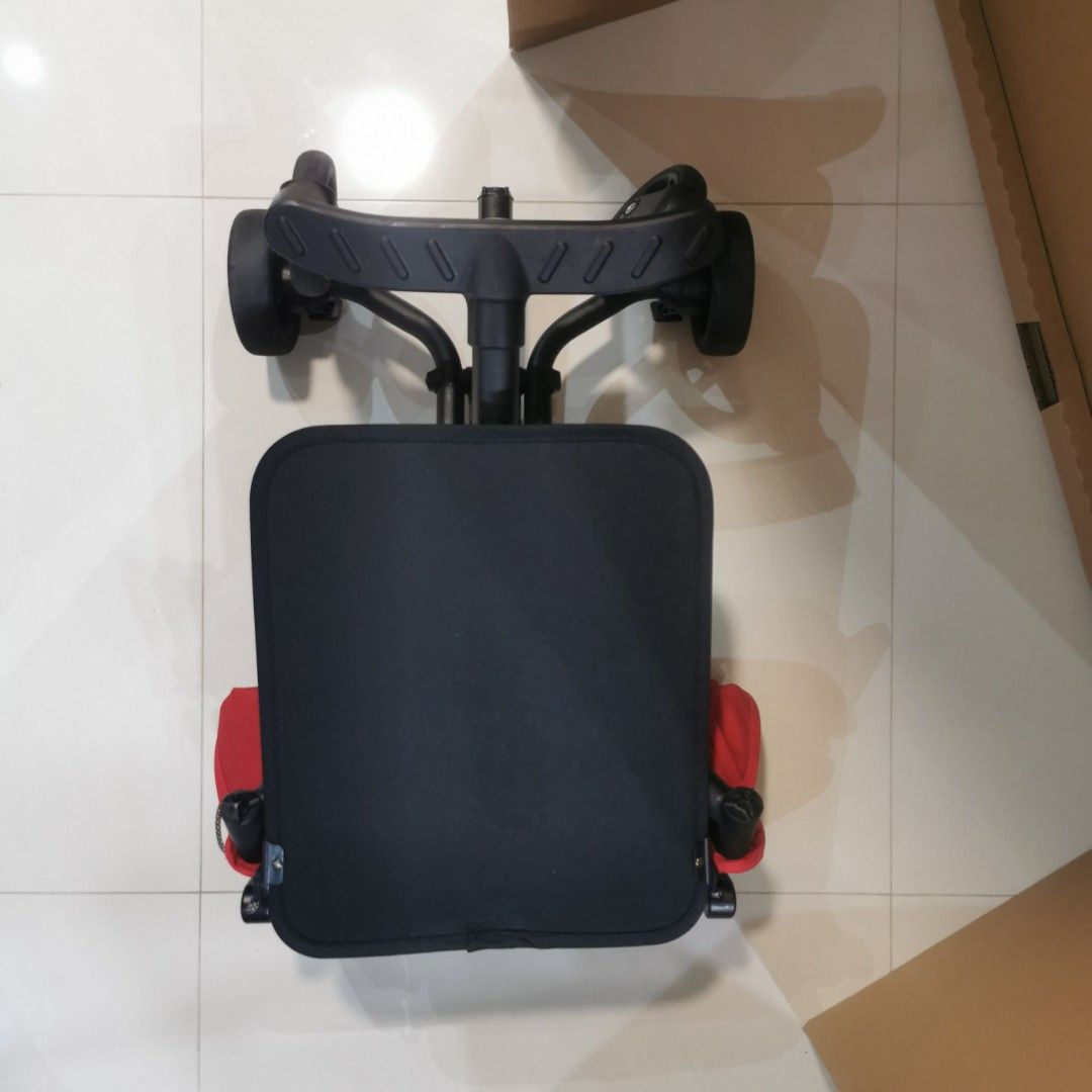 Folder stroller (Category: Strollers) located in Singapore. Submitted by stevejy (Listing ID 1354850331, Image 6). Description: Foldable red colour stroller Cabin Size 57cm x 32cm x 14 com 2.8 kg when folded Bottom footrest come with a blinking light when press Suitable for user weight up to 22 kg One hand folding Include an IKEA DIMPA storage bag for carry out.