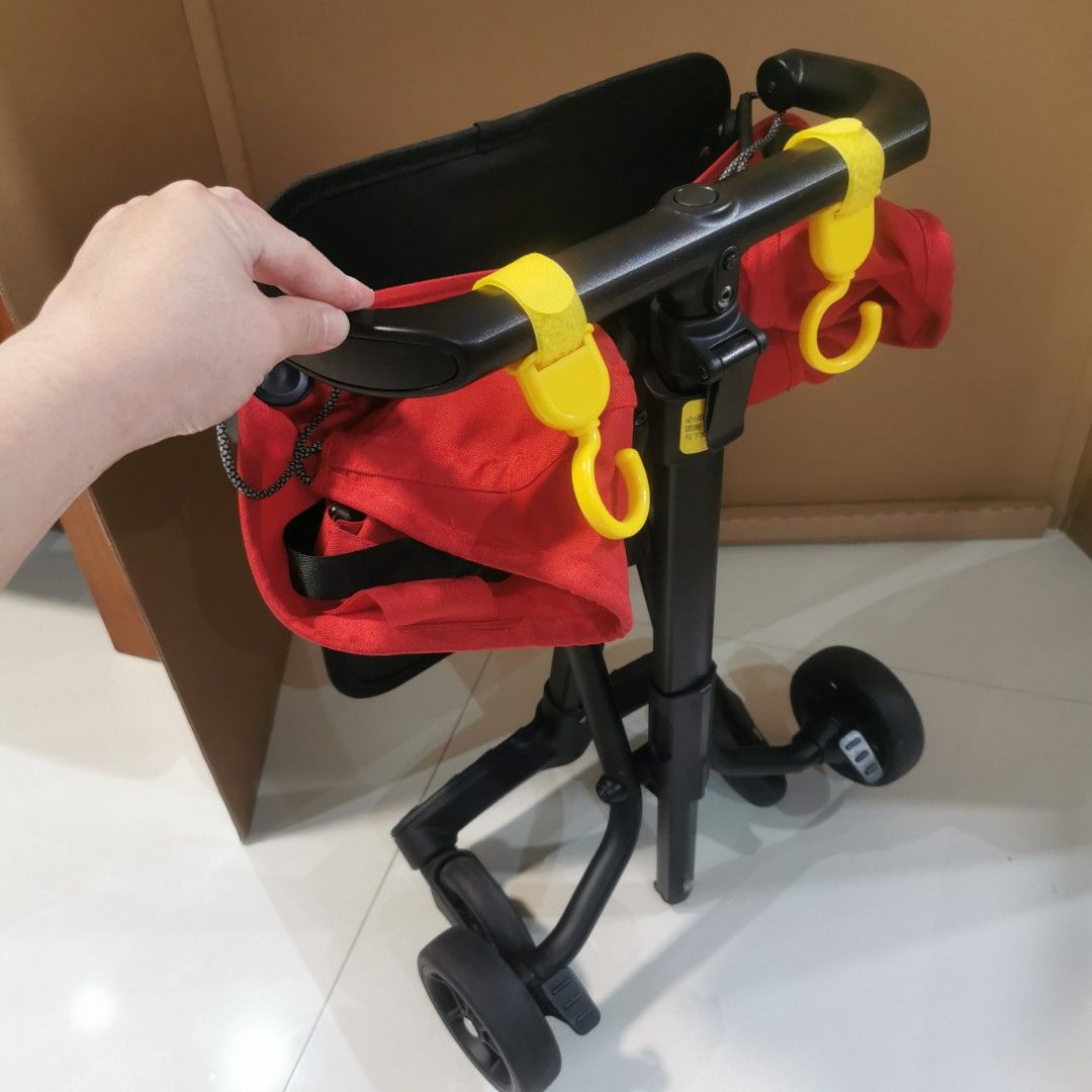 Folder stroller (Category: Strollers) located in Singapore. Submitted by stevejy (Listing ID 1354850331, Image 3). Description: Foldable red colour stroller Cabin Size 57cm x 32cm x 14 com 2.8 kg when folded Bottom footrest come with a blinking light when press Suitable for user weight up to 22 kg One hand folding Include an IKEA DIMPA storage bag for carry out.