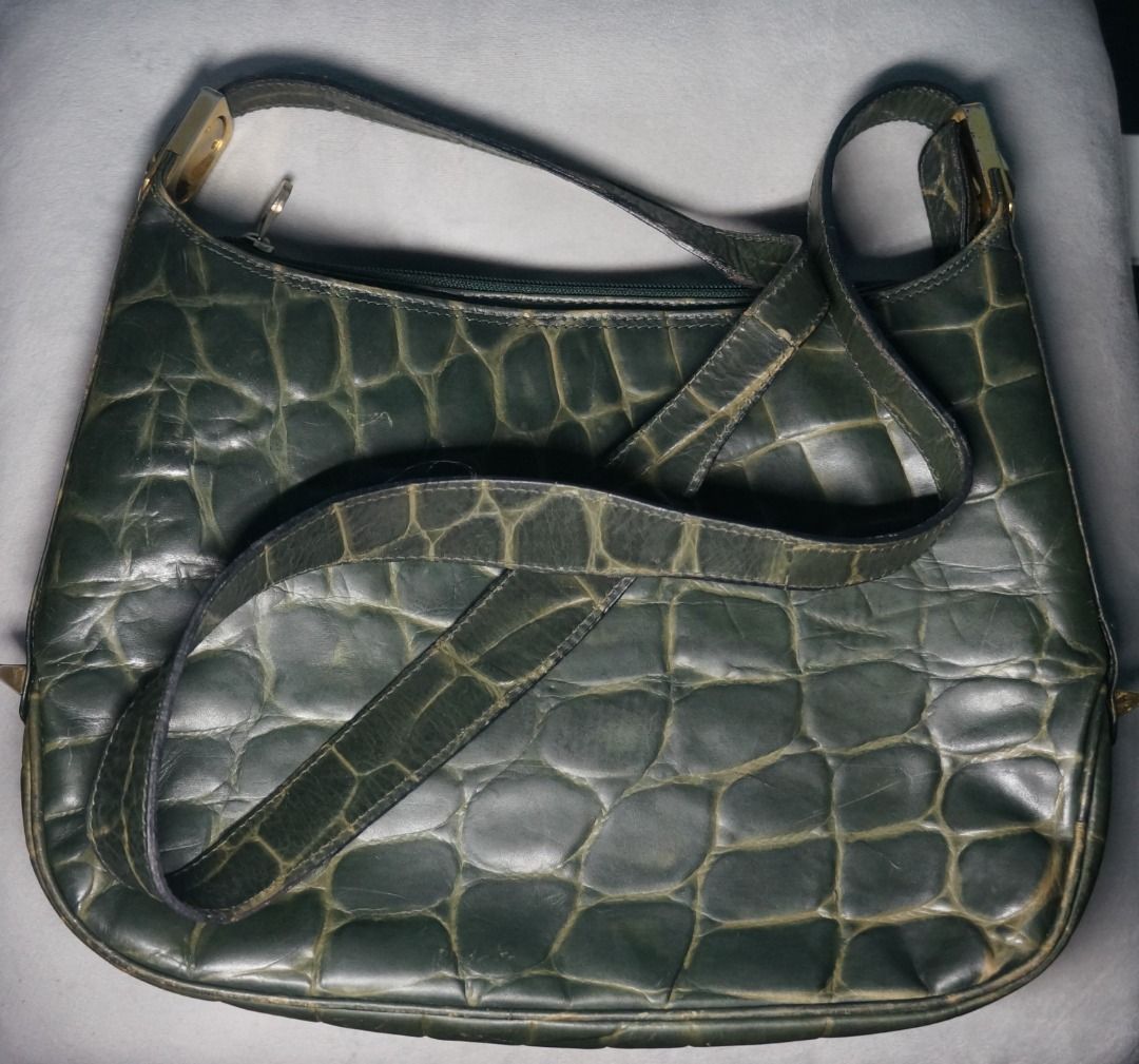 Green Leather Adjustable Shoulder Bag (Category: Shoulder Bags) located in Taguig. Submitted by tcstuff (Listing ID 1354885030, Image 1). Description: Genuine Leather Shoulder Bag — Made in Italy Adjustable strap, pwedeng long shoulder bag, pwedeng kili bag. Bag Measurements: 11.5 in x 8.2 in x 2.3 in Lining Material: Leather Bag has 3 compartments. The middle one has a zipper. On the zipper compartment, it has a zippered pocket inside. Newly cle