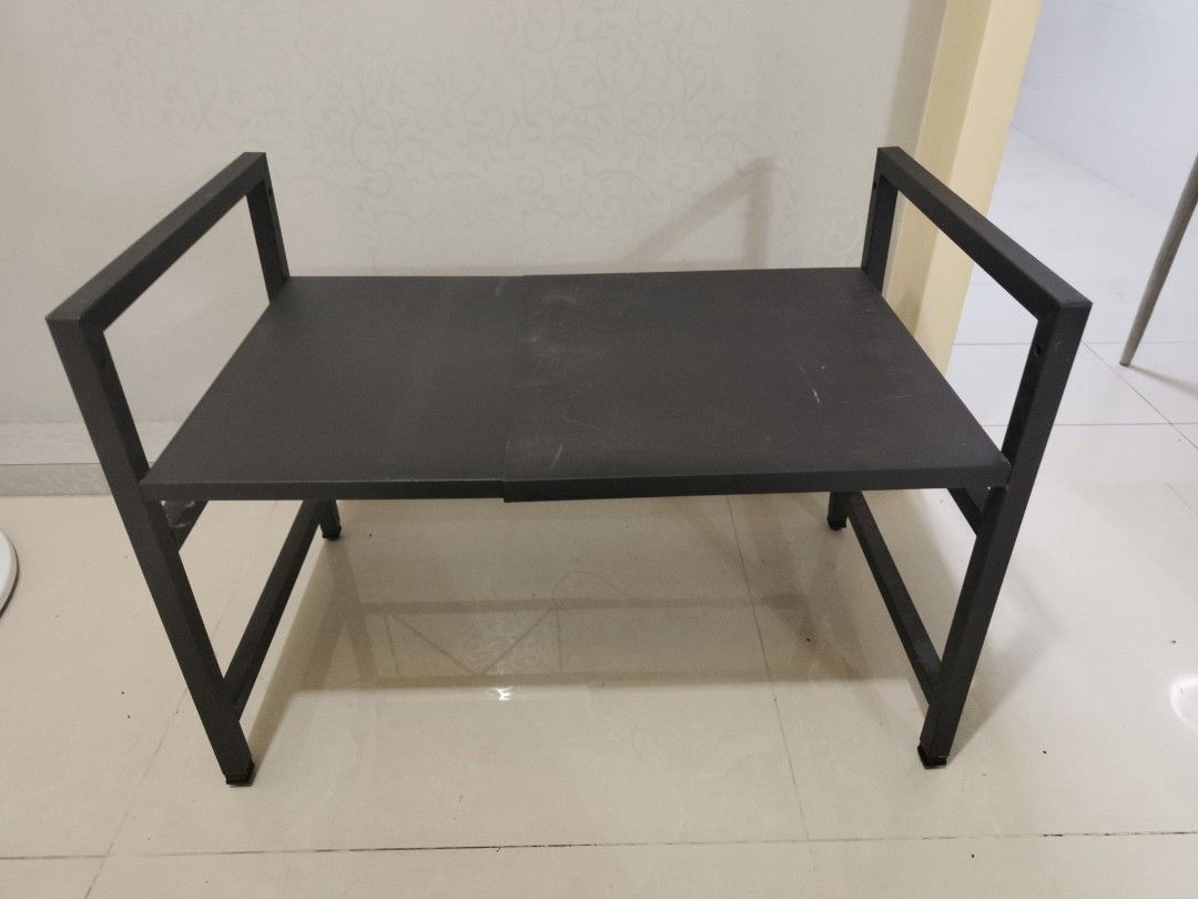 Rack adjustable width (Category: Shelves, Cabinets & Racks) located in Singapore. Submitted by hellocrs (Listing ID 1354836066, Image 2). Description: Shelving rack for kitchen to put microwave or oven at bottom and others on top, to save space. Width is adjustable to fit size of different electrical home appliances Made of metal. Almost brand new. Not used before..