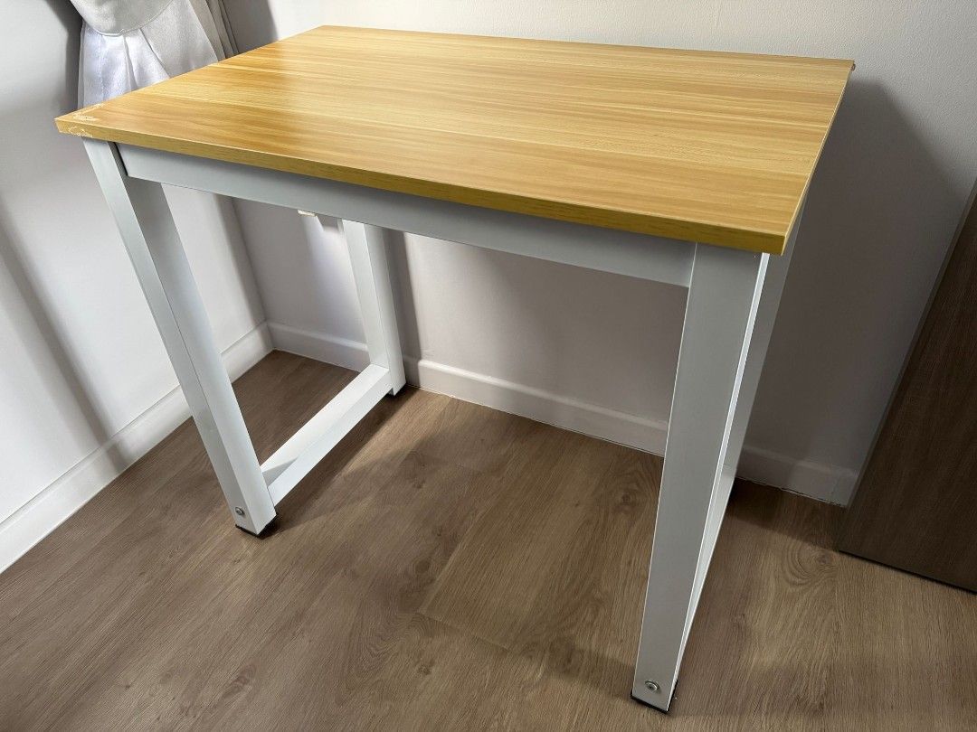 Study Table (Category: Tables & Sets) located in Singapore. Submitted by JH2022 (Listing ID 1354742814, Image 1). Description: size: 80cm (L) X 50cm(W) X 74cm(ht) wood surface with steel legs, very stable.