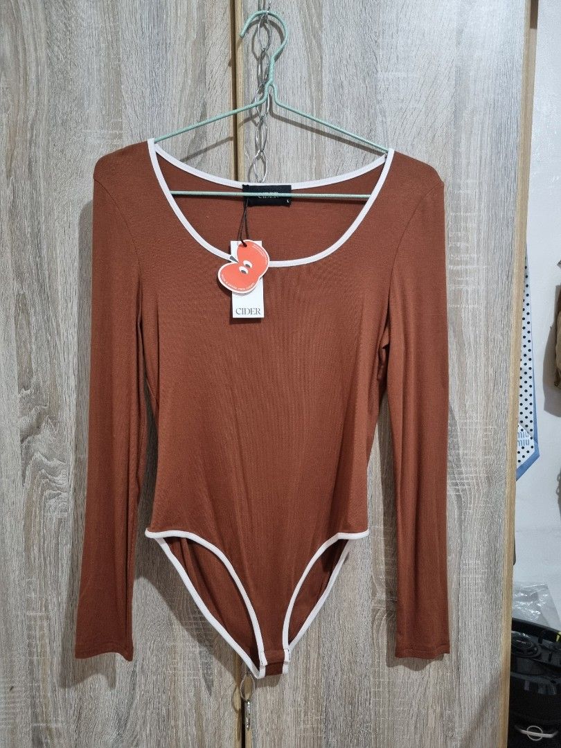 Cider Cotton Longsleeve Bodysuit (Tan) (Category: Tshirts & Polo Shirts ) located in Bulacan. Submitted by justlyn24 (Listing ID 1355089999, Image 1). Description: Size: Large on tag Fabric: Cotton (malamig sa katawan) Color: Tan & White Searcheable po sa app MOP: BPI/Maya/Metrobank Courier: J&T ( I used pagibig discount para makasave po kayo) 😊.