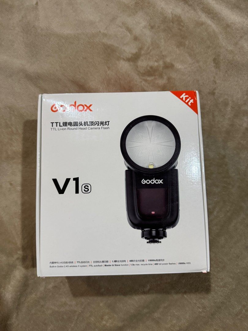 Godox V1s TTL Li-ion Round Head Camera Flash Kit (Category: Lighting & Studio Equipment) located in Naga. Submitted by sweetdeclutters_ (Listing ID 1354953000, Image 2). Description: With Missing USB Battery Charging Duct (see last photo) Key Features Compatible with Sony ADI / P-TTL Output: 76Ws Auto Zoom Control, Zoom Range: 28-105mm 2.4 GHz Wireless X-System Transmitter Built-In LED Modeling Lamp Tilts -7 to 120°, Rotates 330° Round Flash Head
