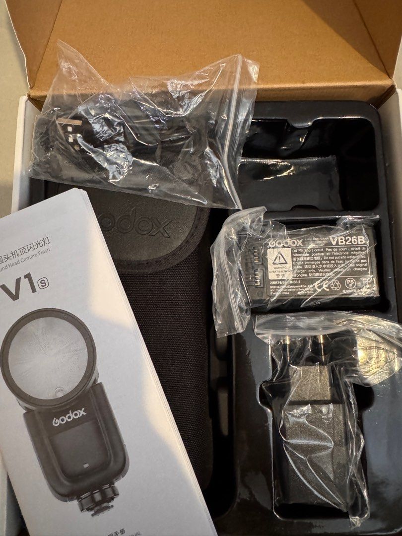 Godox V1s TTL Li-ion Round Head Camera Flash Kit (Category: Lighting & Studio Equipment) located in Naga. Submitted by sweetdeclutters_ (Listing ID 1354953000, Image 3). Description: With Missing USB Battery Charging Duct (see last photo) Key Features Compatible with Sony ADI / P-TTL Output: 76Ws Auto Zoom Control, Zoom Range: 28-105mm 2.4 GHz Wireless X-System Transmitter Built-In LED Modeling Lamp Tilts -7 to 120°, Rotates 330° Round Flash Head