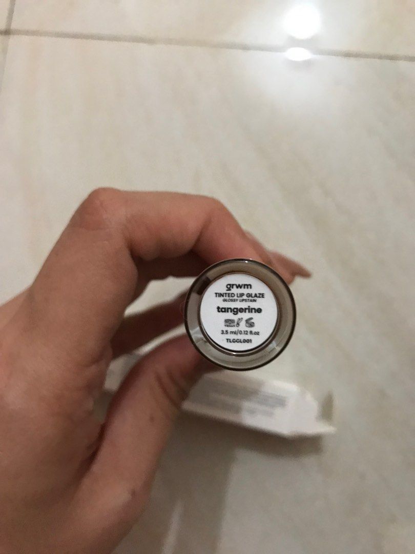 GRWM Tinted Lip Glaze (Tangerine) (Category: Makeup) located in Pasay City. Submitted by spongefinds (Listing ID 1354983585, Image 2). Description: rfs: picked out the wrong color Box opened but not the lipstick itself.