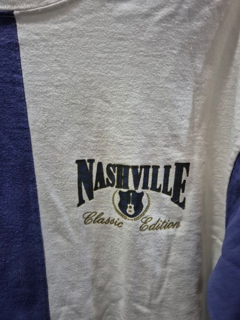 Nashville graphic shirt (Category: Tshirts & Polo Shirts ) located in Marikina City. Submitted by phorts (Listing ID 1354971826, Image 2). Description: fits M-L 30L x 21W issues include slight discoloration on inner neckline and some dirt on the body, washable and can send additional pictures actual color of the shirt is off white talaga.
