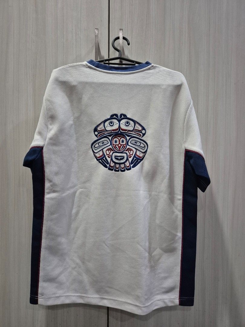 White dri-fit graphic jersey (Category: Tshirts & Polo Shirts ) located in Marikina City. Submitted by phorts (Listing ID 1354971317, Image 2). Description: fits M-L 28L x 21W no major issues.