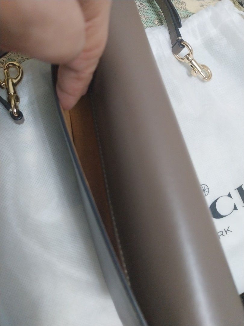 Brandnew coach 3 way bag (Category: Luxury Bags & Wallets) located in Manila. Submitted by nyeragiti (Listing ID 1355172579, Image 3). Description: brandnew coach 3 way bag, clutch, sling and as kiki-kili bag. i etoupe color, fits 2 samsung phones, lippie, slim mirror, keys and roll on perfume. gcash or bpi payment lalamove or grab delivery only.