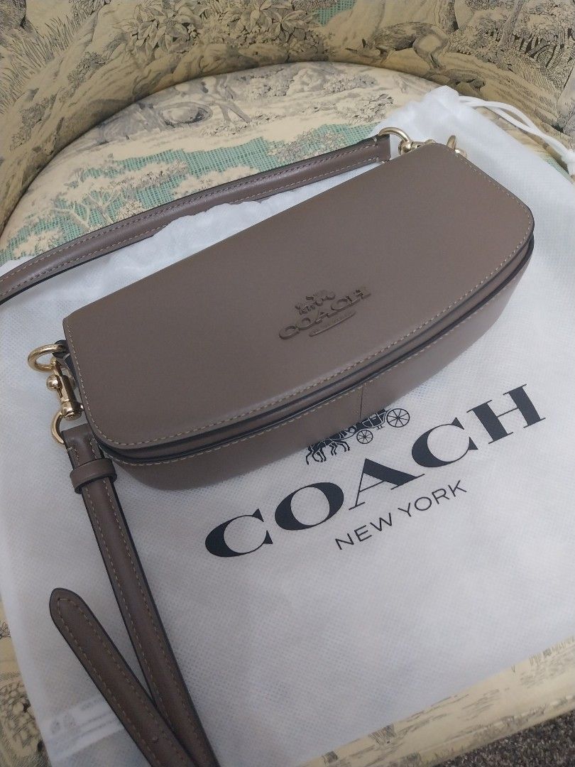 Brandnew coach 3 way bag (Category: Luxury Bags & Wallets) located in Manila. Submitted by nyeragiti (Listing ID 1355172579, Image 2). Description: brandnew coach 3 way bag, clutch, sling and as kiki-kili bag. i etoupe color, fits 2 samsung phones, lippie, slim mirror, keys and roll on perfume. gcash or bpi payment lalamove or grab delivery only.