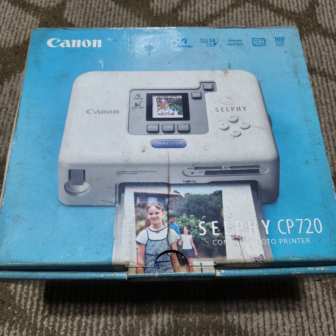 Canon Selphy CP720 (Category: Printers, Scanners & Copiers) located in Taguig. Submitted by sakiyasa (Listing ID 1355253052, Image 1). Description: Never been used. But there is a stuck cartridge during checking. Complete accessories with their plastic packagings..