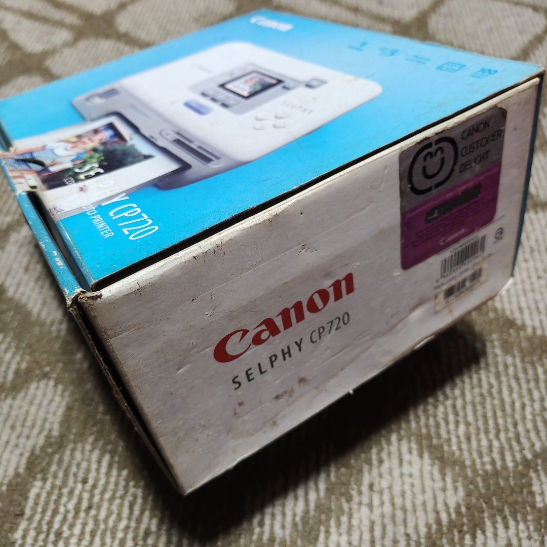 Canon Selphy CP720 (Category: Printers, Scanners & Copiers) located in Taguig. Submitted by sakiyasa (Listing ID 1355253052, Image 2). Description: Never been used. But there is a stuck cartridge during checking. Complete accessories with their plastic packagings..